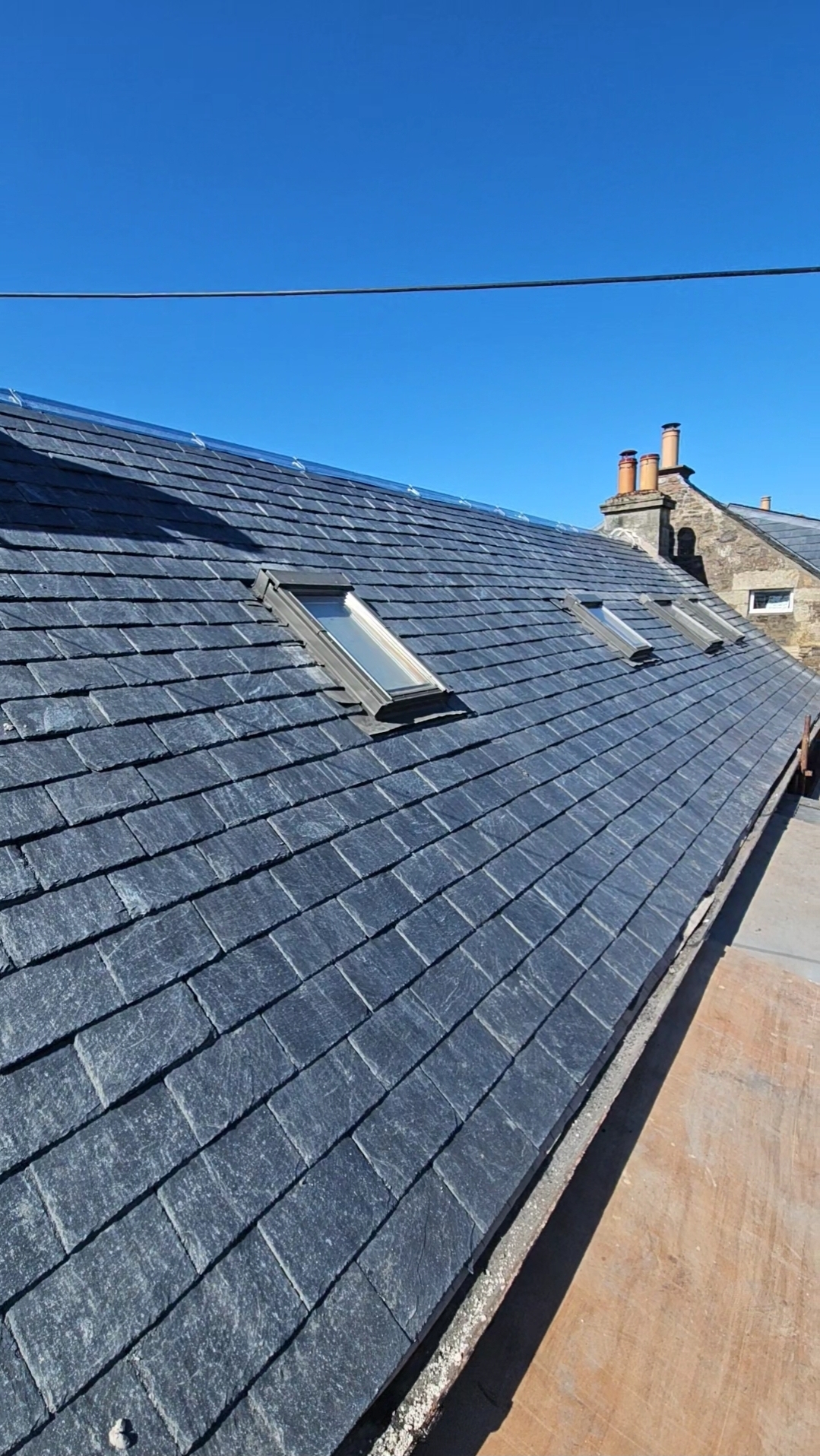 New slate roof with dual Velux windows